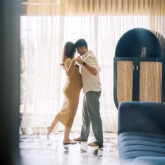 Who says a maternity session can't include a little dance? I love capturing spontaneous moments of joy like this. It shows the couple's personality and the fun they share, all within the comfort of their own living room.
