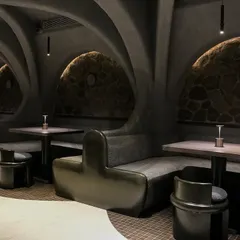 Your theme is our command. The unique, cave-like interior of Call Me Ten required completely bespoke seating solutions. We manufactured these curved booths and chairs to fit the architecture perfectly, creating an intimate and one-of-a-kind fine dining atmosphere.