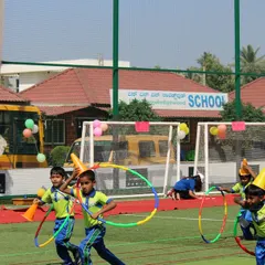 Fun and games for the little ones. We set up various activity stations, like this hula hoop challenge, to ensure every child has a fantastic time during their school event.