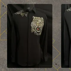 The 'ROAR' Tiger Shirt. This striking black shirt features an intricately embroidered tiger, allowing you to wear your strength and confidence. It is a bold, handcrafted, and unapologetically fierce statement piece.