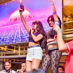 Guests on stage, completely lost in the music. I create an environment where everyone feels free to celebrate and be the star of the show.