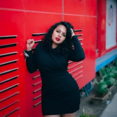 I use bold colors and strong compositions to make fashion portraits pop. This shot against a vivid red wall in Bangalore shows how an urban environment can become a dynamic studio for creating high-impact images.