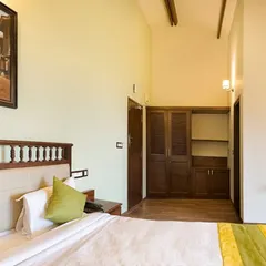 Our double rooms offer a cozy and serene environment for your stay. The room features a comfortable bed, ample storage, and warm lighting to create a restful atmosphere.