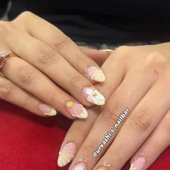 This elegant set features sculpted shell textures on the tips and hand-crafted 3D florals with tiny gold accents. The combination of textures on a soft blush base creates a truly sophisticated and artistic look.