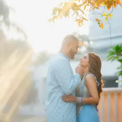 Bathed in beautiful golden sunlight, this couple shares a laugh during their outdoor Haldi ceremony. We love using natural light to create a warm, dreamy glow that enhances the joyful atmosphere.