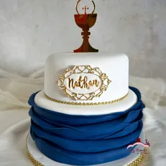 This elegant cake was for a First Holy Communion, but with a festive twist inside. The client requested my rich Christmas plum cake, which I covered in smooth fondant and marzipan for a sophisticated finish.