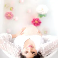 A serene and artistic milk bath portrait. This unique session is a beautiful way to capture the tranquility and magic of pregnancy.