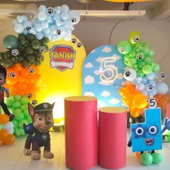 A vibrant Paw Patrol theme for a 5th birthday celebration. This setup includes custom arched backdrops, character cutouts of Chase and Ryder, and colorful balloon arrangements to bring the popular cartoon to life. I can customize the name and age for any theme.