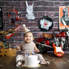 This little rockstar is ready for his first world tour, starting with this cake! Themed cake smashes, like this 'Born to Rock' setup, add a layer of personality to the celebration.