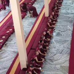 A view of the Sangha at Sera Jey Monastery during a formal ceremony. This image shows hundreds of monks seated in rows for a meal, reflecting the profound tradition, discipline, and scale of monastic life that our center is connected to.