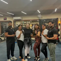 Posing with some of my dedicated clients and fellow trainers. We are a team committed to helping you transform your life.