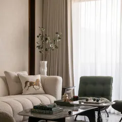 I layered soft curves, natural light, and thoughtful textures to create this calm and collected living area. The boucle sofa, marble coffee table, and touches of green create a quietly luxurious space, perfect for lounging or hosting an intimate coffee date.