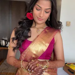 A beautiful portrait of a client in a traditional saree, her dark henna stain adding to the richness of her look.