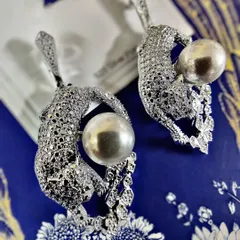 Unleash your wild side with these exquisite diamond-studded leopard earrings holding a lustrous pearl. This is a perfect example of my Feng Shui inspired collection, bringing together power and elegance in one statement piece.