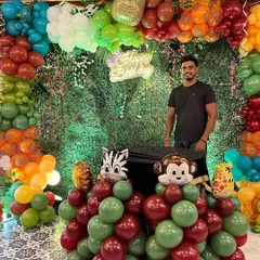 Here I am with the completed jungle theme setup. I love seeing a creative vision come to life.