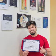 Another one. Holding my finalist certificate for International Vivid Colorist of the Year. I'm always pushing to be at the top of my game.
