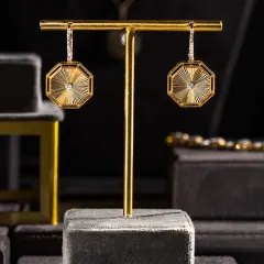Some pieces don’t ask for attention, they earn it. These octagonal earrings from the Eternal Collection blend clean diamond geometry with intricate gold work, built for the woman who keeps her luxury subtle.