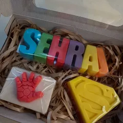 Superheroes meet personalization! This custom gift box combines a colorful name soap for 'Sehrai' with an Iron Man hand soap and a Superman logo soap, creating the perfect gift for a little hero.