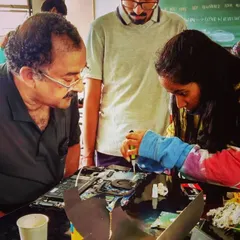 Here, one of our expert mentors guides a young learner through the process of troubleshooting a laptop. Our sessions focus on providing step by step guidance, ensuring every child understands the core concepts of gadget repair and maintenance.