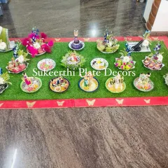 A beautiful and extensive platter arrangement for an engagement at Jenny Club. The setup includes a variety of seer items, each decorated with unique handmade dolls and flowers.