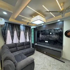 Another view of the drawing room, showing the L-shaped sofa and the full entertainment wall. The design is perfect for a contemporary home.