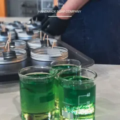 My expertise extends beyond soap. Here you can see me preparing to pour handmade candles, another product available for private label. I can help you build a complete, cohesive brand with a range of artisan-quality goods.