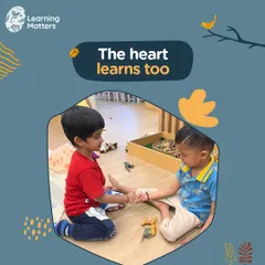 The heart learns too. This gentle moment of connection between two children is a beautiful example of developing empathy and social awareness. We create spaces where these quiet, meaningful interactions can flourish.