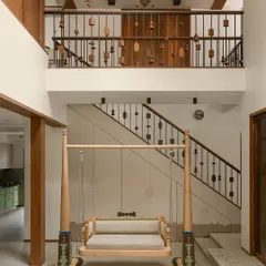 For our Kolam Pop project, we brought traditional South Indian aesthetics into a modern Mumbai home. The central courtyard features a custom-designed Oonjal, or swing, turning a simple transitional space into the heart of the home, perfect for family connection.