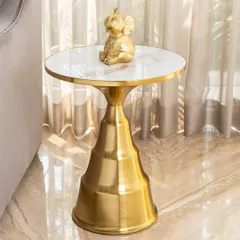The Golden Glow side table is elegant, useful, and striking. Its tapered, tiered golden base is made from stainless steel and is topped with a clean white artificial marble surface, perfect for holding a lamp or your favorite decor.
