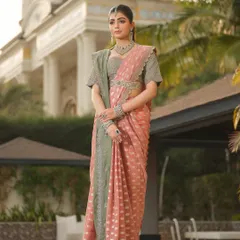 The art of draping is essential to Indian couture. For this Jayanti Reddy saree, I created a clean, pleated drape that showcases the beautiful contrast between the pink body and the sage green border, accented with a statement belt.