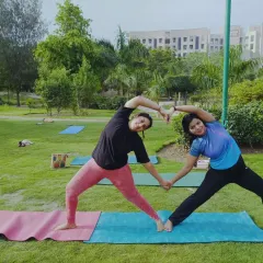 Another variation of a partner heart pose, this time with a side stretch. Partner yoga is a wonderful way to deepen stretches and share the experience with a friend.