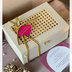 The exterior of our elegant rattan box, tied with a beautiful ribbon and a 'Love, Light & Celebration' tag. It’s the first hint of the wonderful festive goodies packed inside for Diwali.