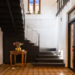 This is the staircase in my own studio, a building we brought back to life after it lay silent for 40 years. We preserved the home's history, keeping the original mitti and brick walls and pairing them with bold, patterned floor tiles. It’s a daily reminder that every space has a story waiting to be told.