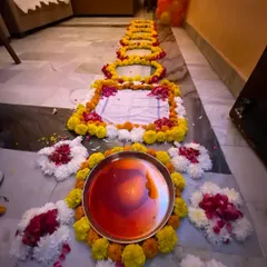 Here is a detail of the traditional welcome pathway I create for a 'griha pravesh' ceremony. I use fresh marigold and other flowers to design the path, including a decorated thali for the welcome ritual, to honor cultural traditions for the newlyweds.