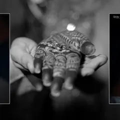 A symbolic black and white photo showing the engagement rings resting in the groom's hand over the bride's henna. It's a beautiful, artistic detail shot.