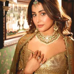 A portrait of royalty. Hina Khan exudes confidence and grace, her look elevated by the intricate craftsmanship of her polki and emerald bridal jewelry set.