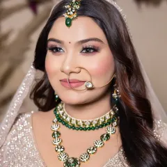 An elegant and soft bridal look with emerald green jewelry. My student learned to balance the makeup with the accessories, creating a cohesive and beautiful final result.