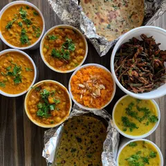 A special order of dehydrated meals for a student travelling abroad, including Methi Theplas, Dal Tadka, Masala Chole, and Kurkuri Bhindi.