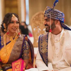 The bride and groom sharing a happy, relaxed moment during their wedding ceremony. Our candid wedding photography aims to document the genuine smiles and conversations.