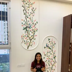 Standing proud with one of my favorite wall mural projects. This piece, featuring peacocks perched on delicate branches, was designed to bring a sense of serene nature into a double-height living space. I love creating large-scale art that completely transforms a room.
