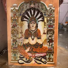 This artwork of Goddess Padmavathi is a celebration of grace, prosperity, and intricate detail. Each semi-precious stone is set by hand to capture her celestial radiance and the abundant blessings she represents, making it a source of wealth and peace.