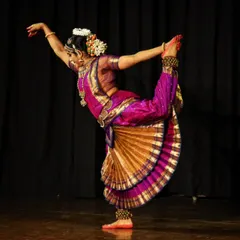 A moment of dynamic energy from my solo production, "Moham". This pose captures the physical discipline and grace that Bharatanatyam demands, showcasing the culmination of years of training in a single, powerful movement on stage.