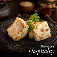 We pair exceptional hospitality with authentic Indian flavors. These succulent pieces of Paneer Malai Tikka, garnished with fresh cilantro, showcase the warmth and care in every dish we serve.