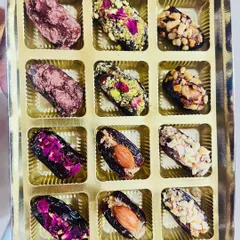 My gourmet stuffed dates are a customer favorite. This beautiful box shows an assortment of flavors, each one a bite of pure indulgence made with natural ingredients like nuts, peanut butter, and vegan dark chocolate.