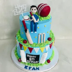A grand two-tier cricket cake for Eyan's 8th birthday. This cake has it all: a custom player figurine, bats, balls, wickets, and pads, all handcrafted from fondant.