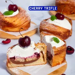 A beautiful display of our Cherry Trifle pastries, with their flaky croissant base and fresh cherry topping.