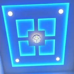 Don't be afraid of color. This bold, geometric design uses vibrant blue backlighting to create a futuristic and energetic mood, perfect for a modern bedroom or entertainment area. The design features sharp lines and spotlights for a clean finish.