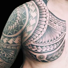 The completed Polynesian chest and shoulder piece. The design uses various geometric patterns and symbols to create a cohesive and powerful statement.
