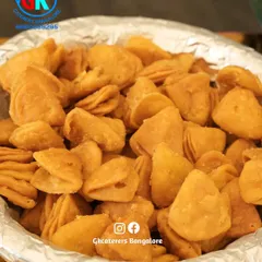 A bowl of crispy, savoury snacks, perfect for munching on during an event.
