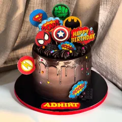 BOOM! BAM! ZAP! This chocolate drip cake is packed with superpowers, featuring logos from Spider-Man, Batman, Superman, and more for a truly marvelous birthday bash.